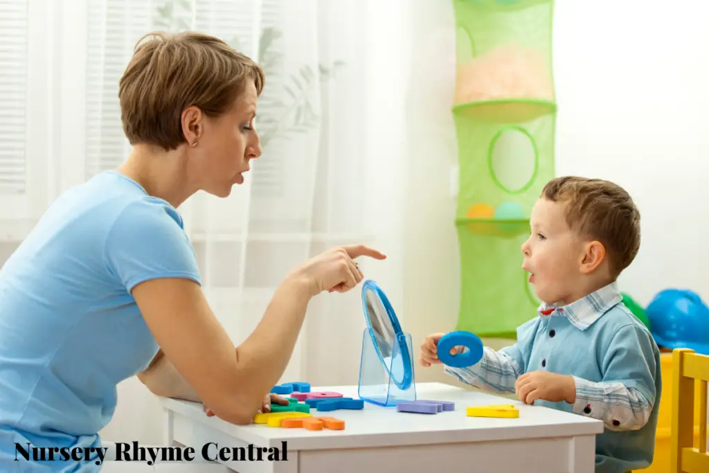 teacher showing O sound to a kid