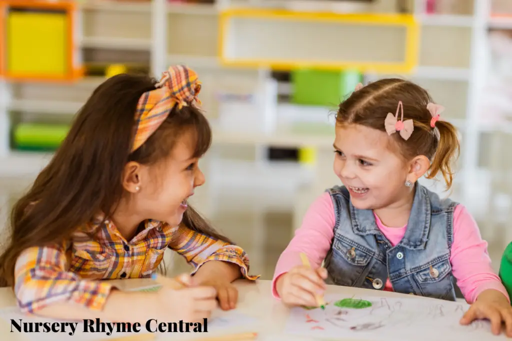 two little kids drawing with crayons